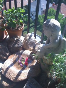 balcony plants and statuary